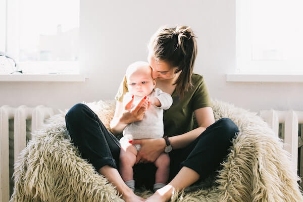 mom playing with baby care promo codes