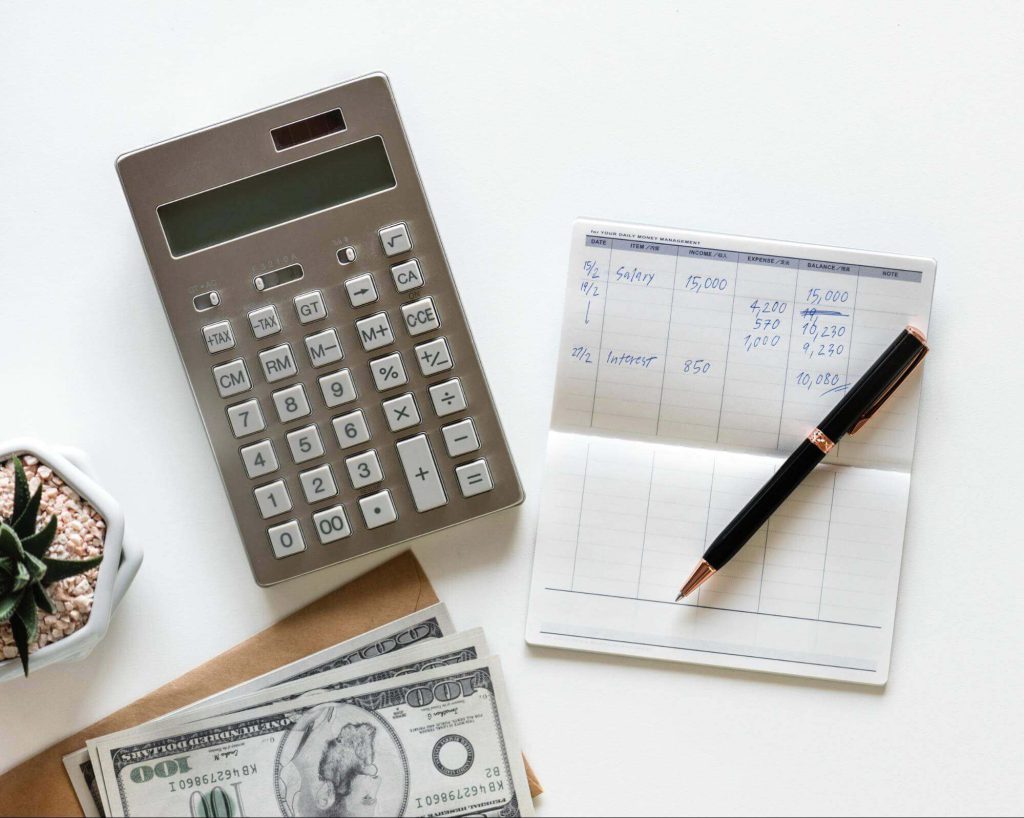 Someone balancing their checkbook