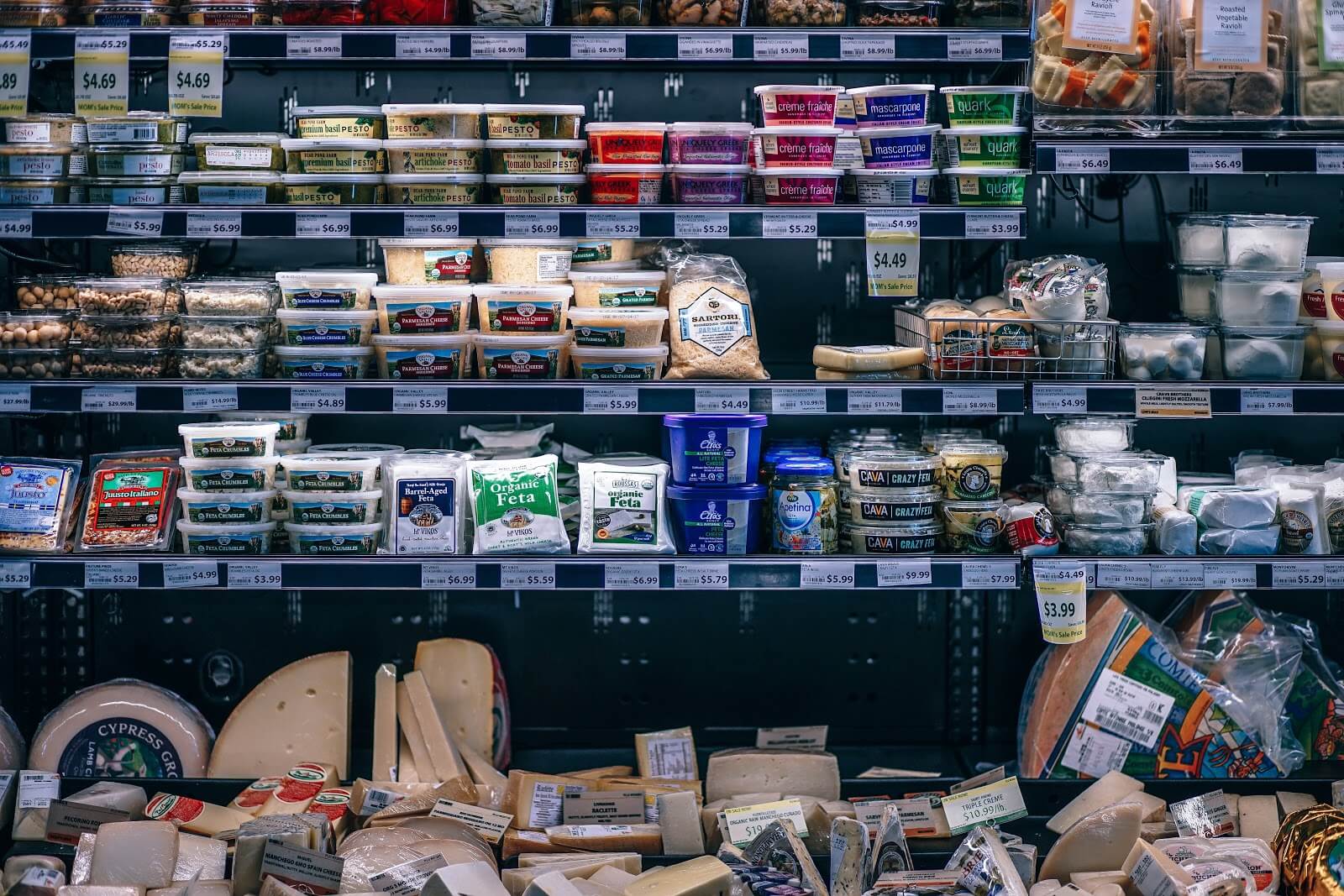 Instacart Coupons: Cheese and spread section in a grocery store