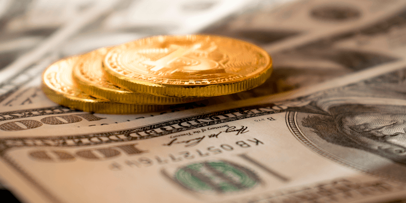 Gold coins and hundred dollar bills