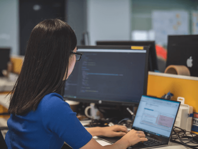 Woman typing on computer