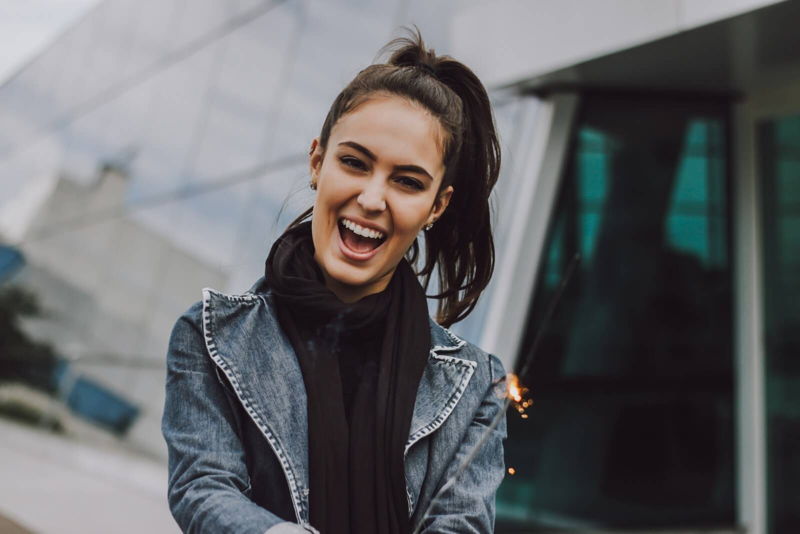 Woman smiling with sparkler