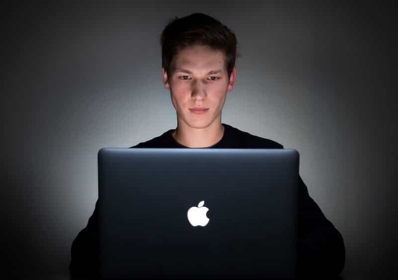 Surveys for money: A man works on his laptop