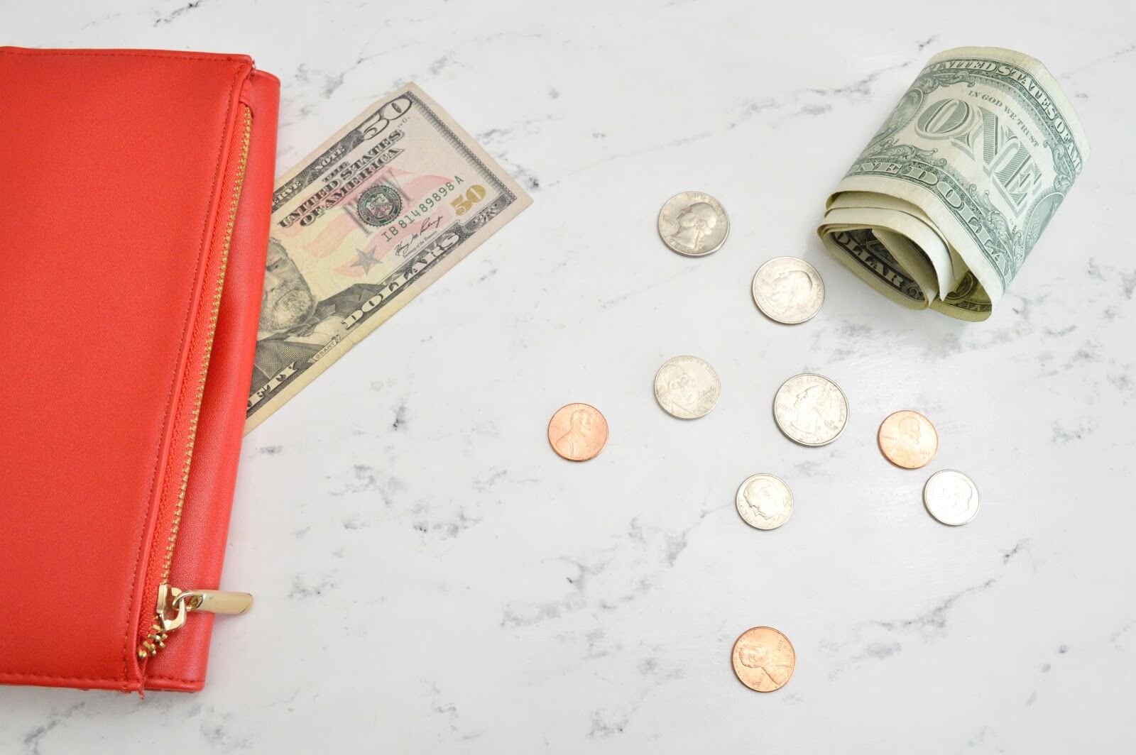 How to make extra money: a wallet and money on a countertop