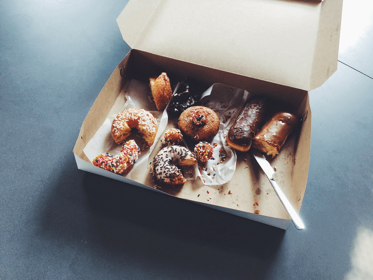 Box of half-eaten donuts