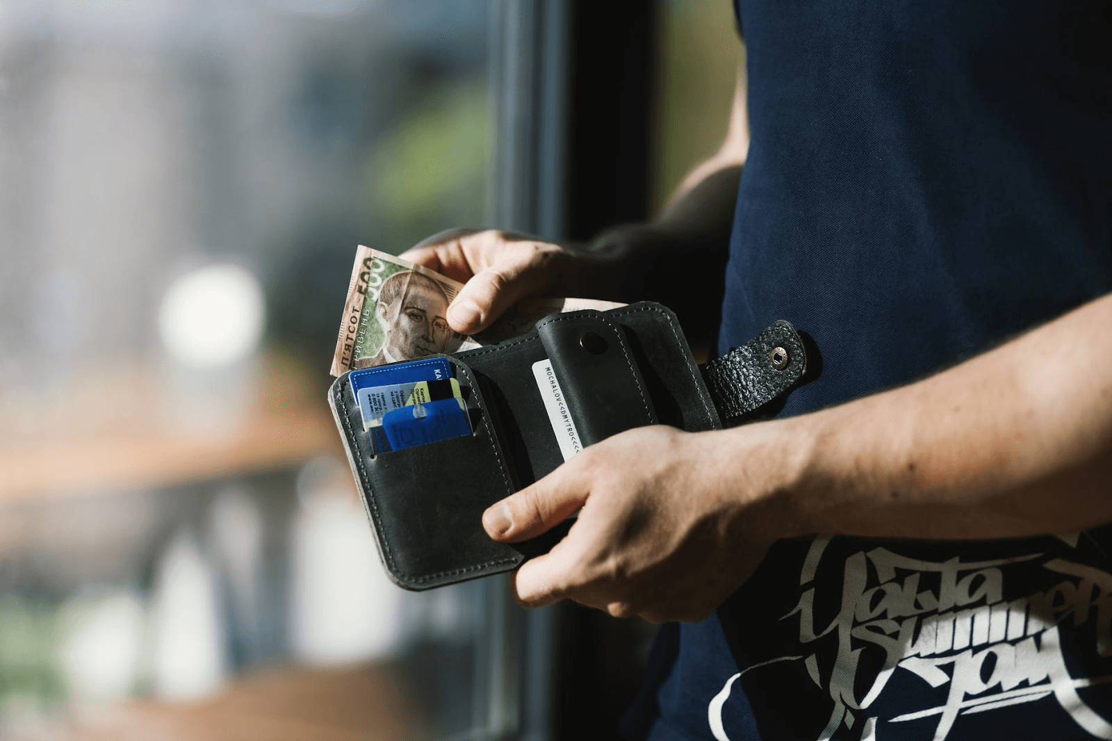 Man taking out money from his wallet
