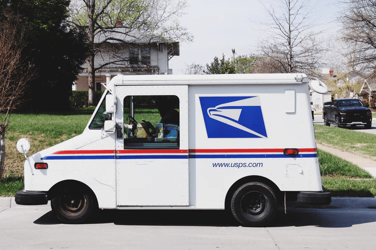 USPS truck parked on a neighborhood street