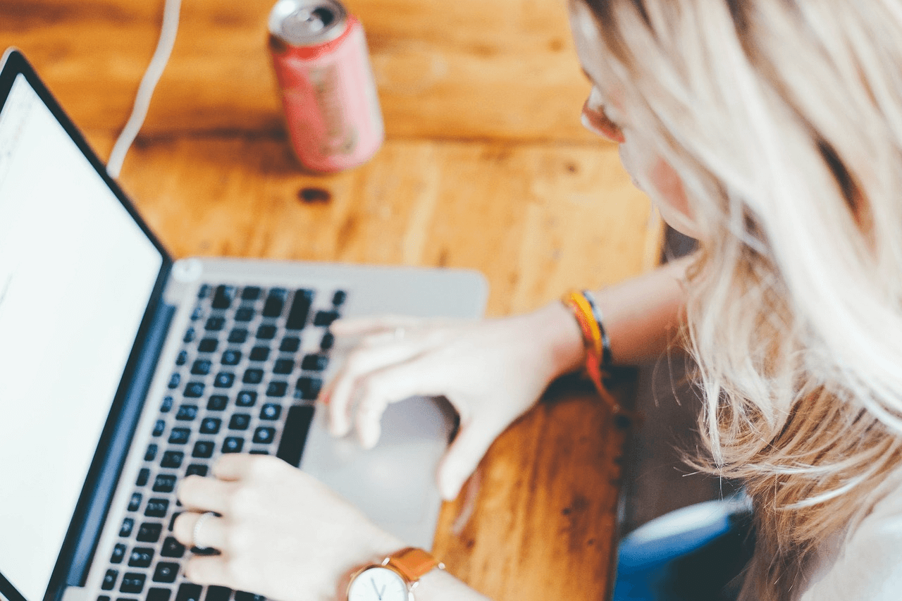 Class action rebates: an overhead shot of a woman on a laptop