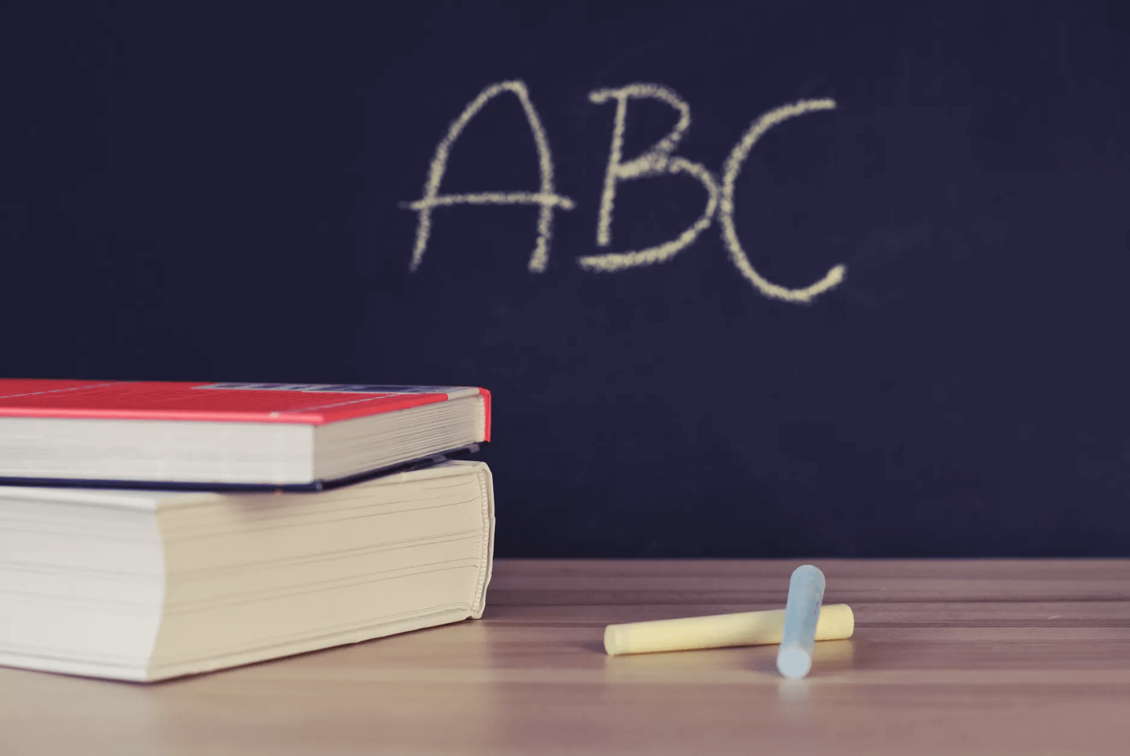 Chalkboard, books, and chalk