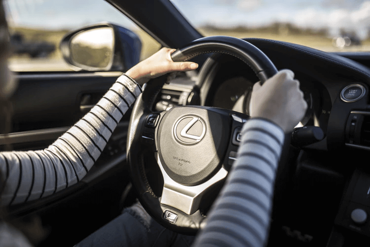 Drive for Lyft: Hands holding a steering wheel