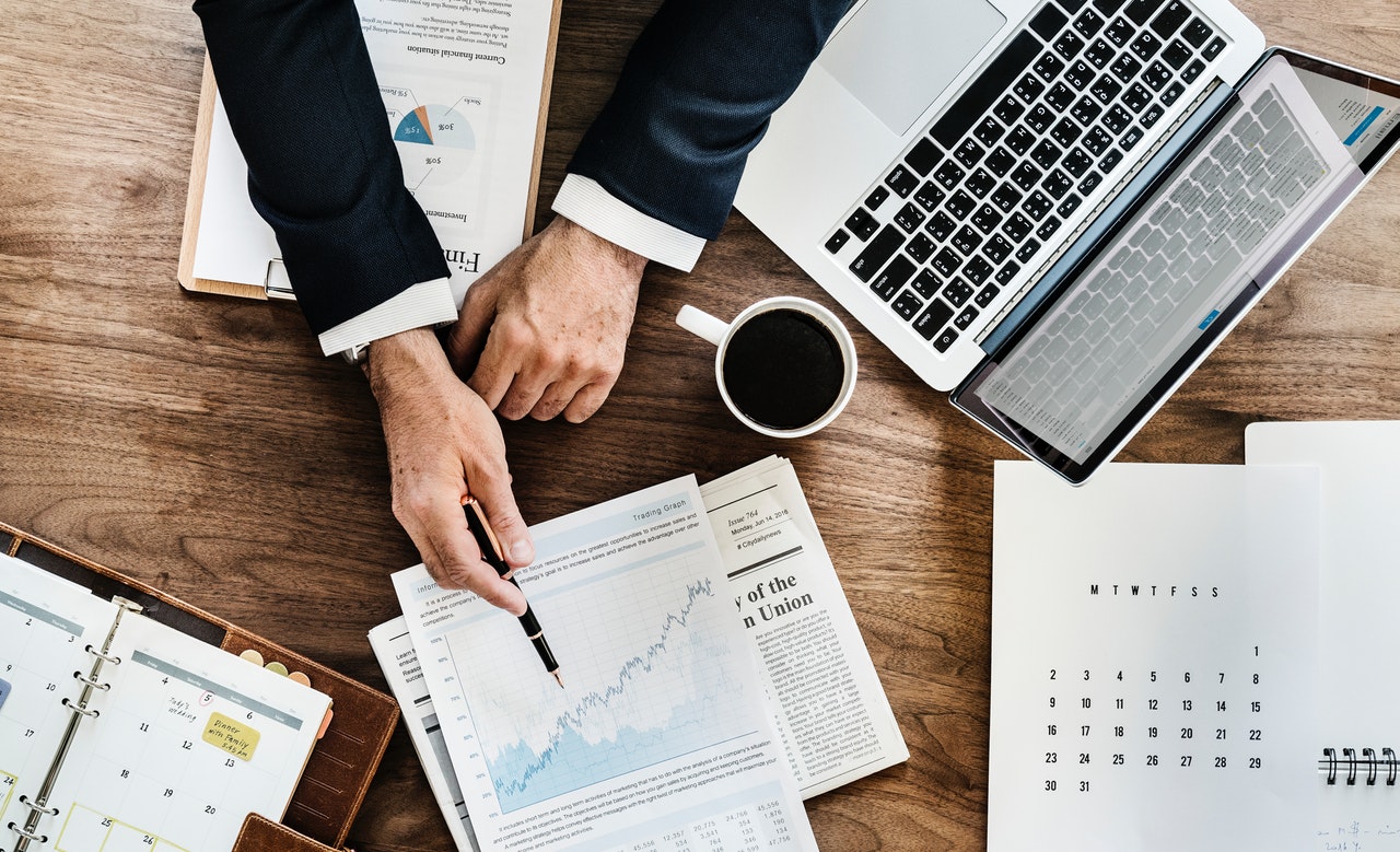 LivePlan: A person goes over business charts and documents