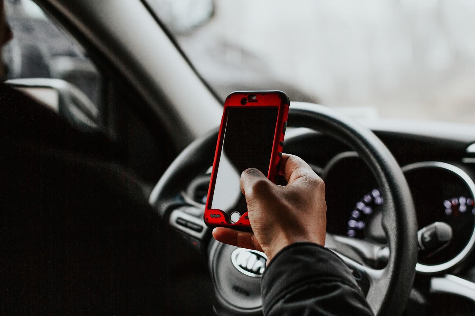 Uber complaints: A driver looks at his phone screen