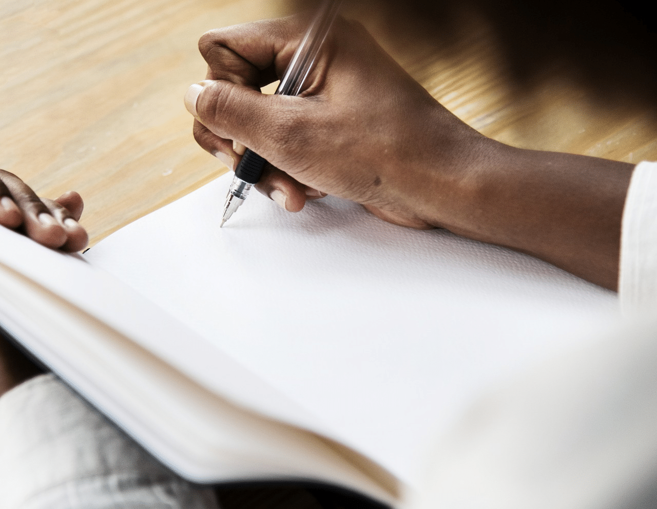 Hand writing in a journal
