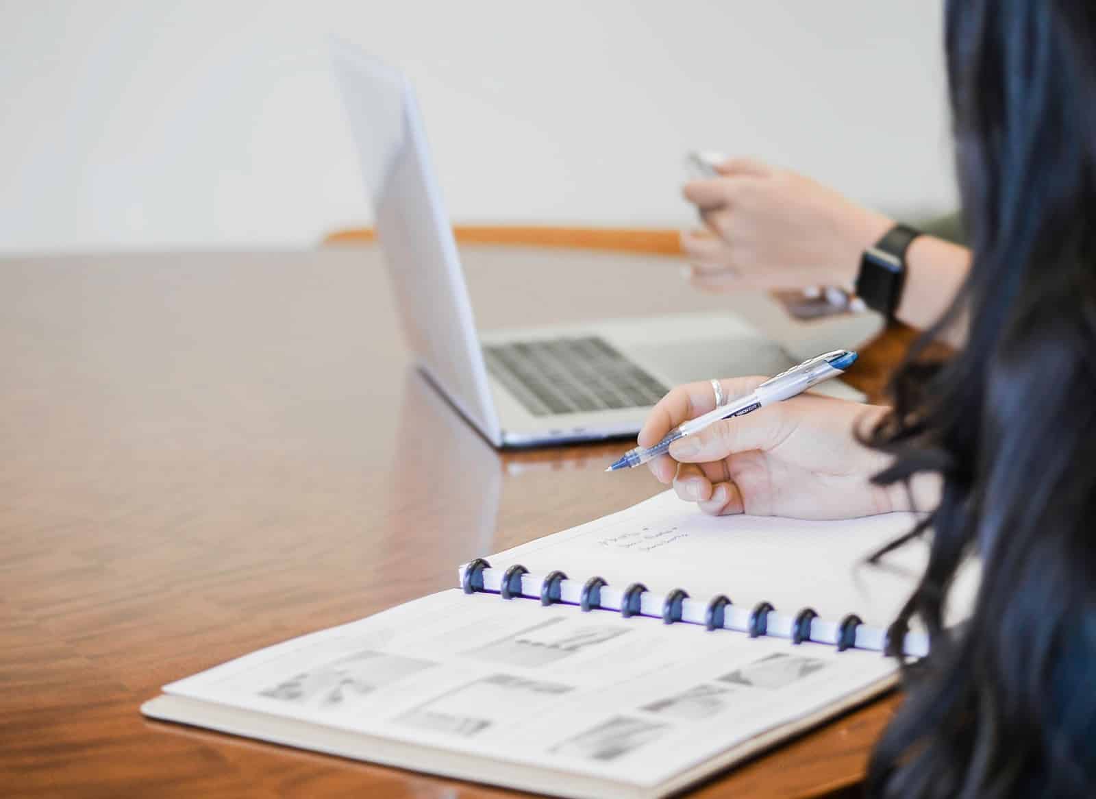 What is accounts receivable: A woman writes on a ledger