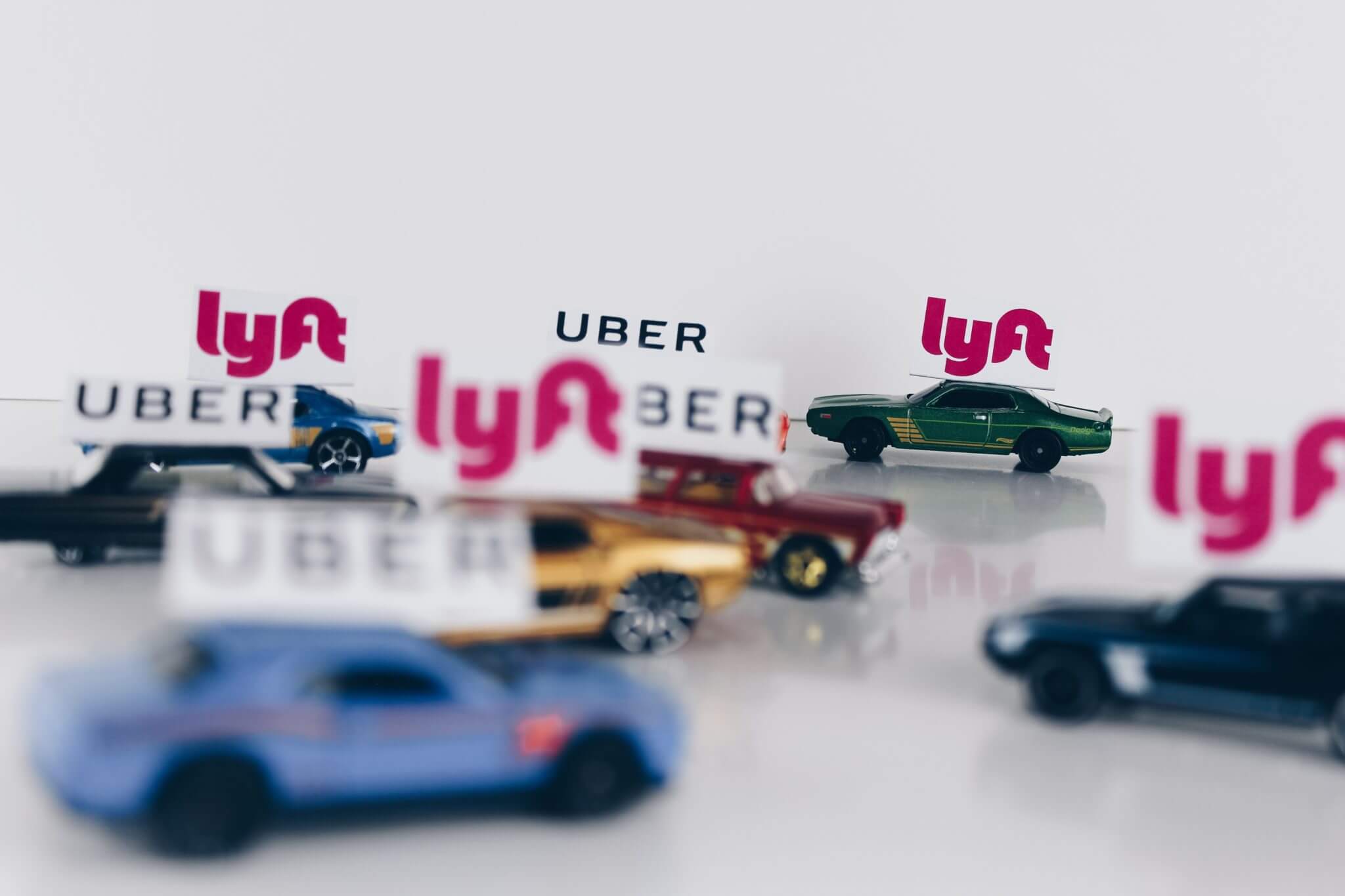 Lyft amp: toy cars with Lyft signs on top