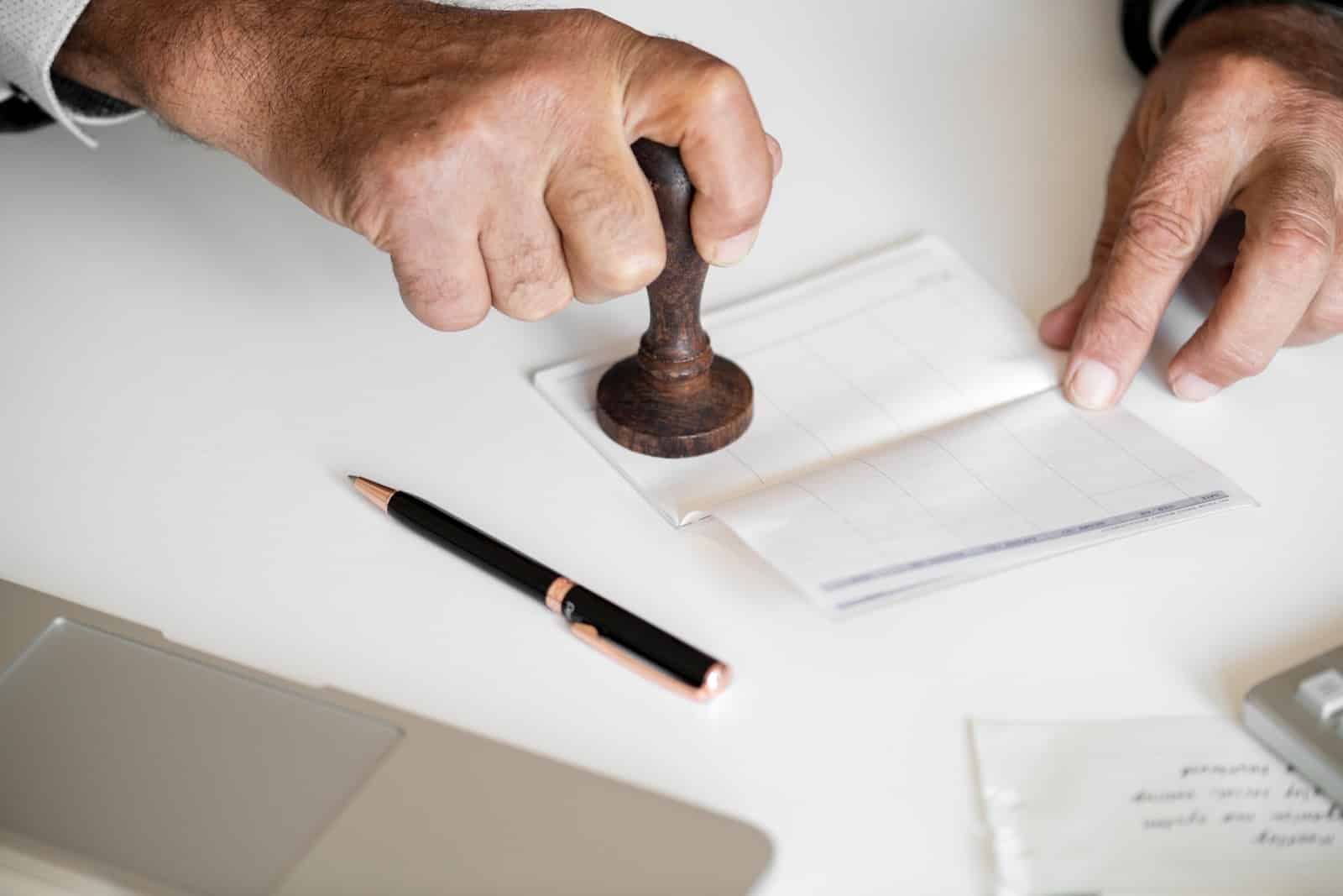 What is collateral? Person stamping checkbook