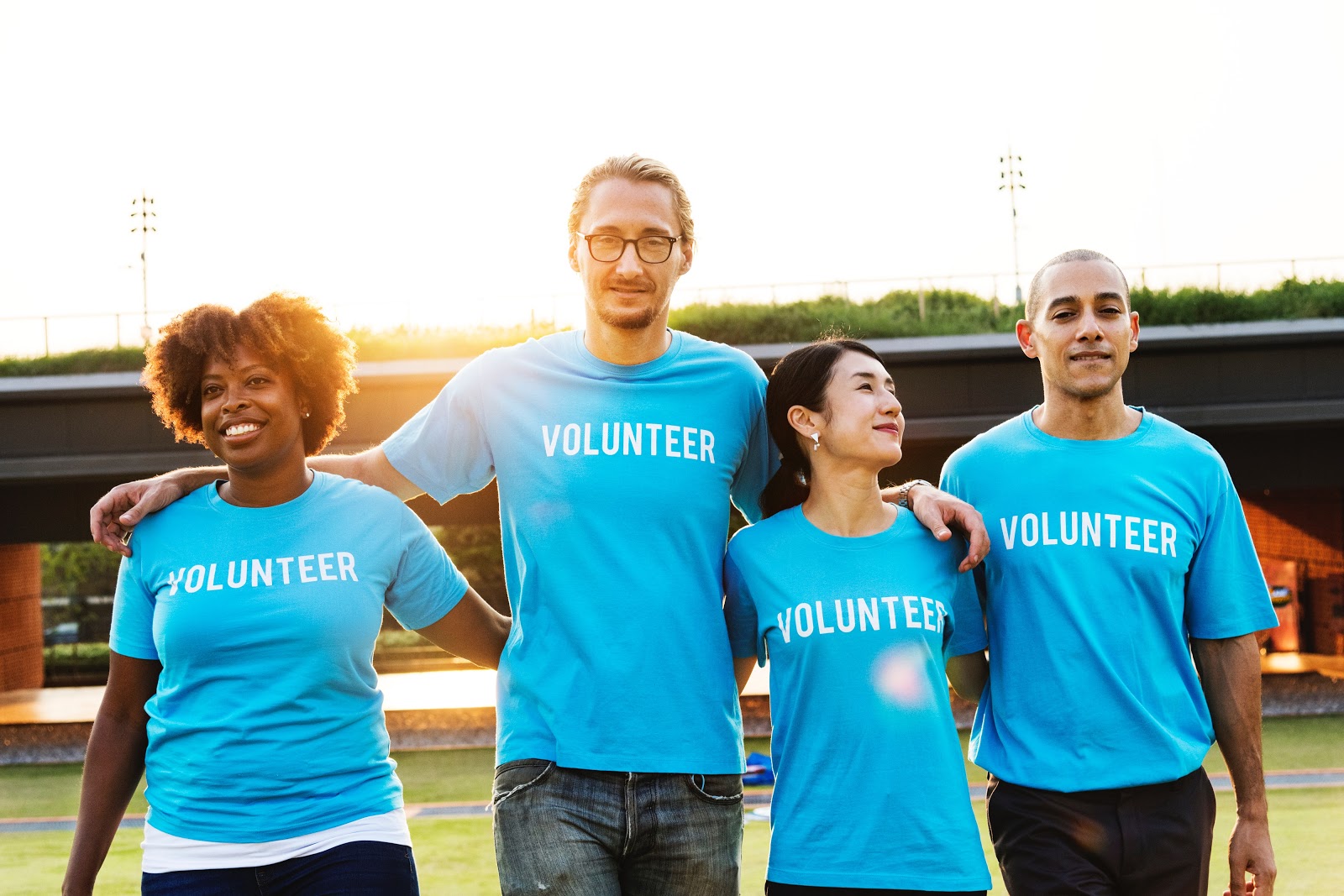 Crowdfunding sites: a group of people in "volunteer" shirts