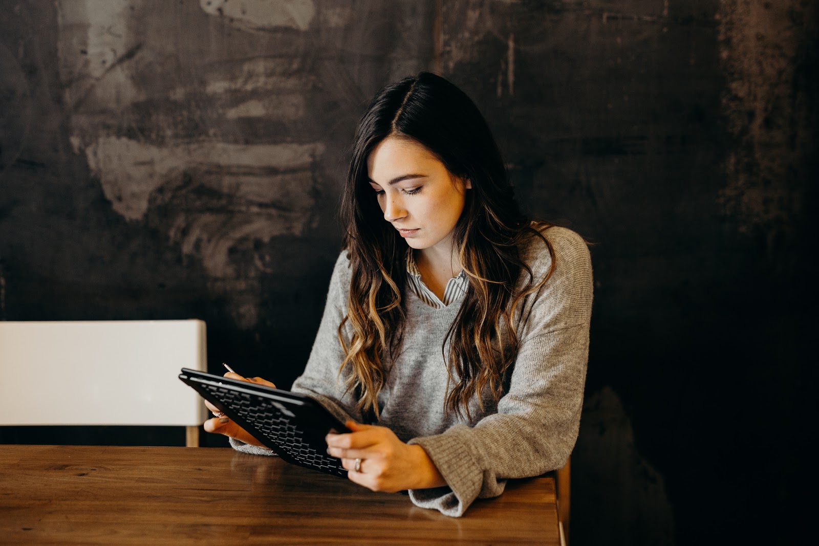 Toptal: A woman works on a tablet