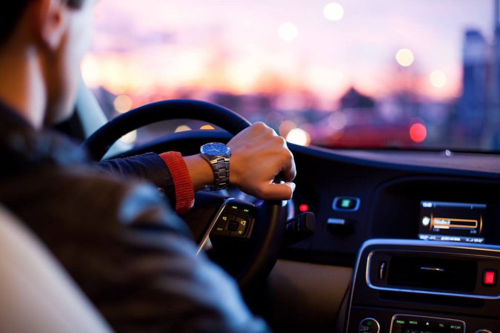 Man driving a vehicle in the city
