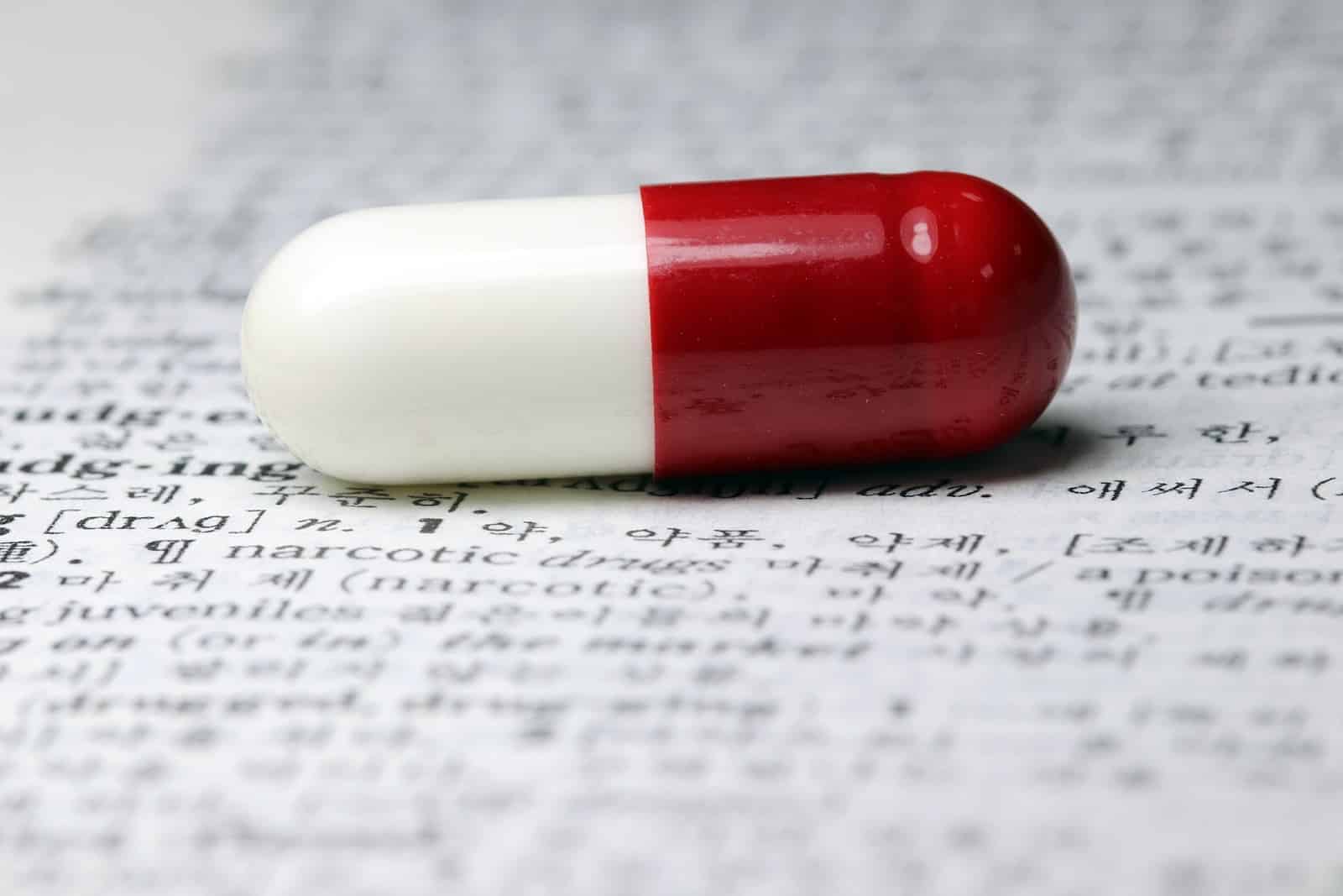 Work-from-home pharmacist jobs: a pill on a page with technical writing