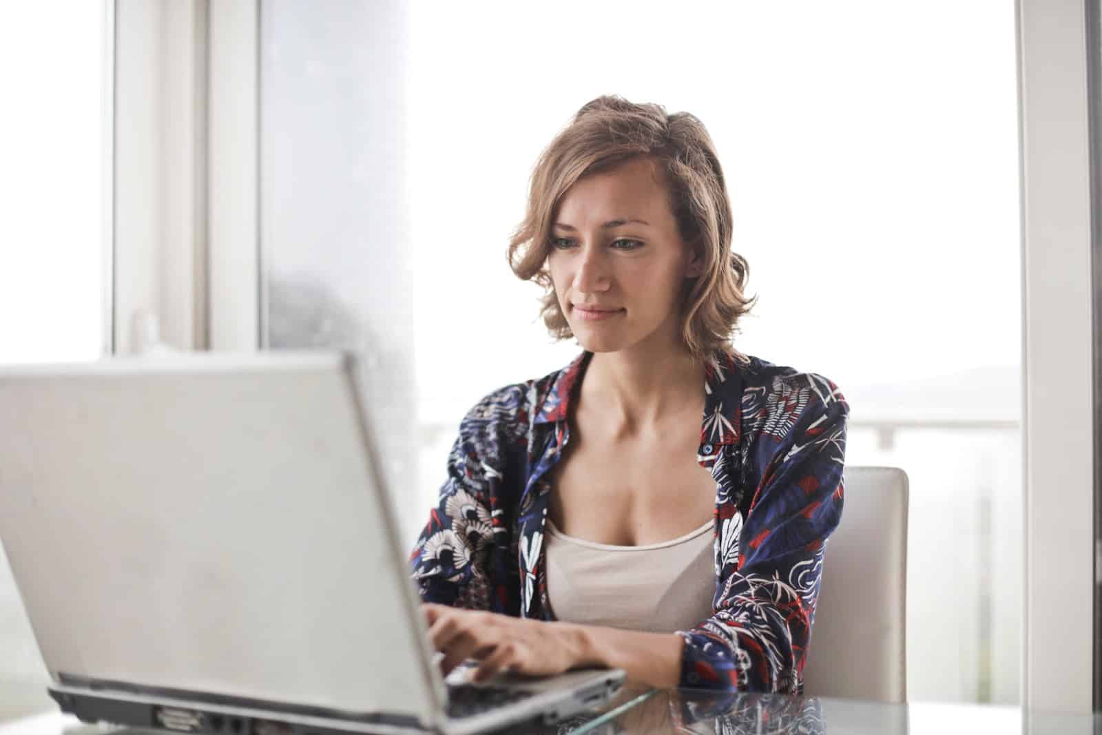 Woman works at laptop