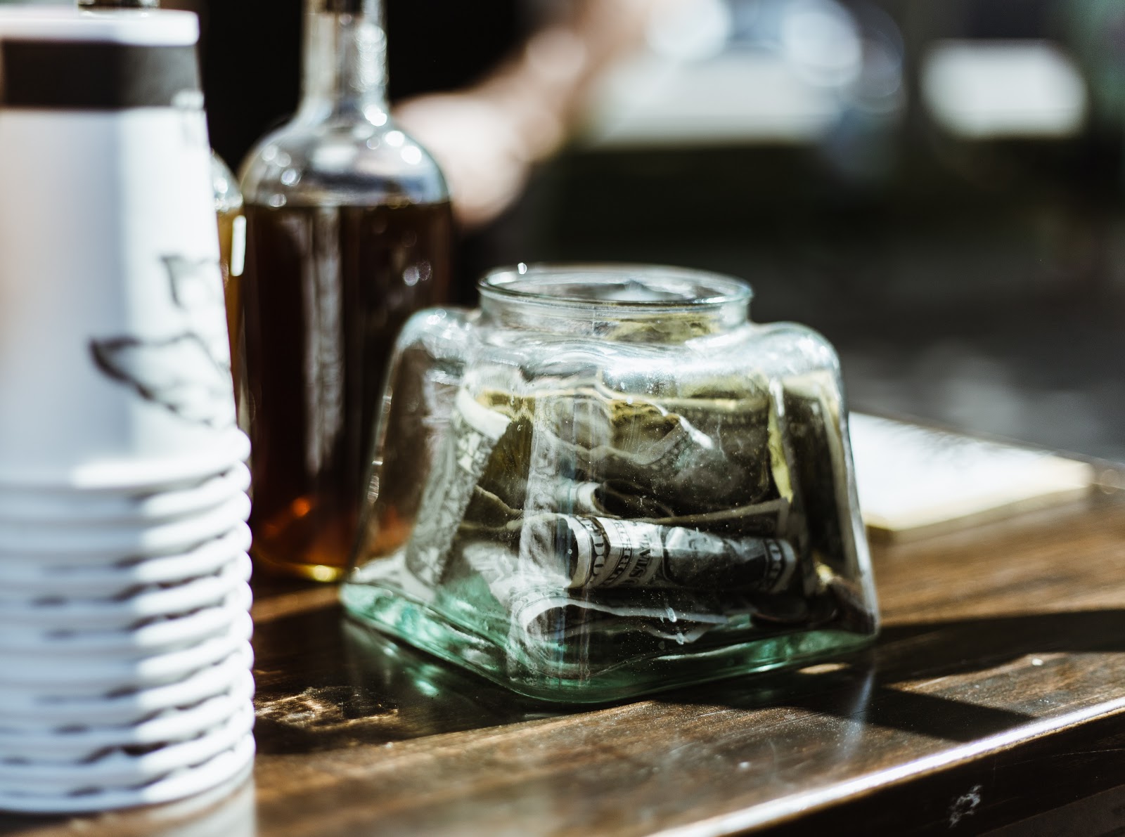 Bar with a jar full of tips