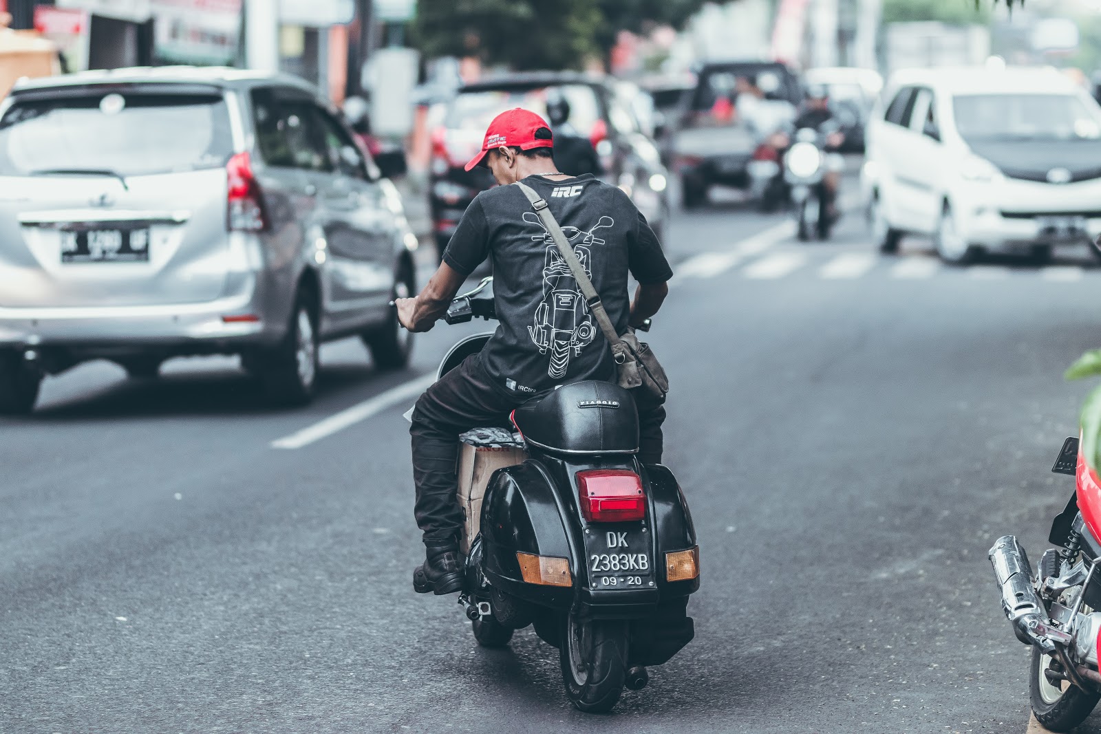 A courier on a motorbike