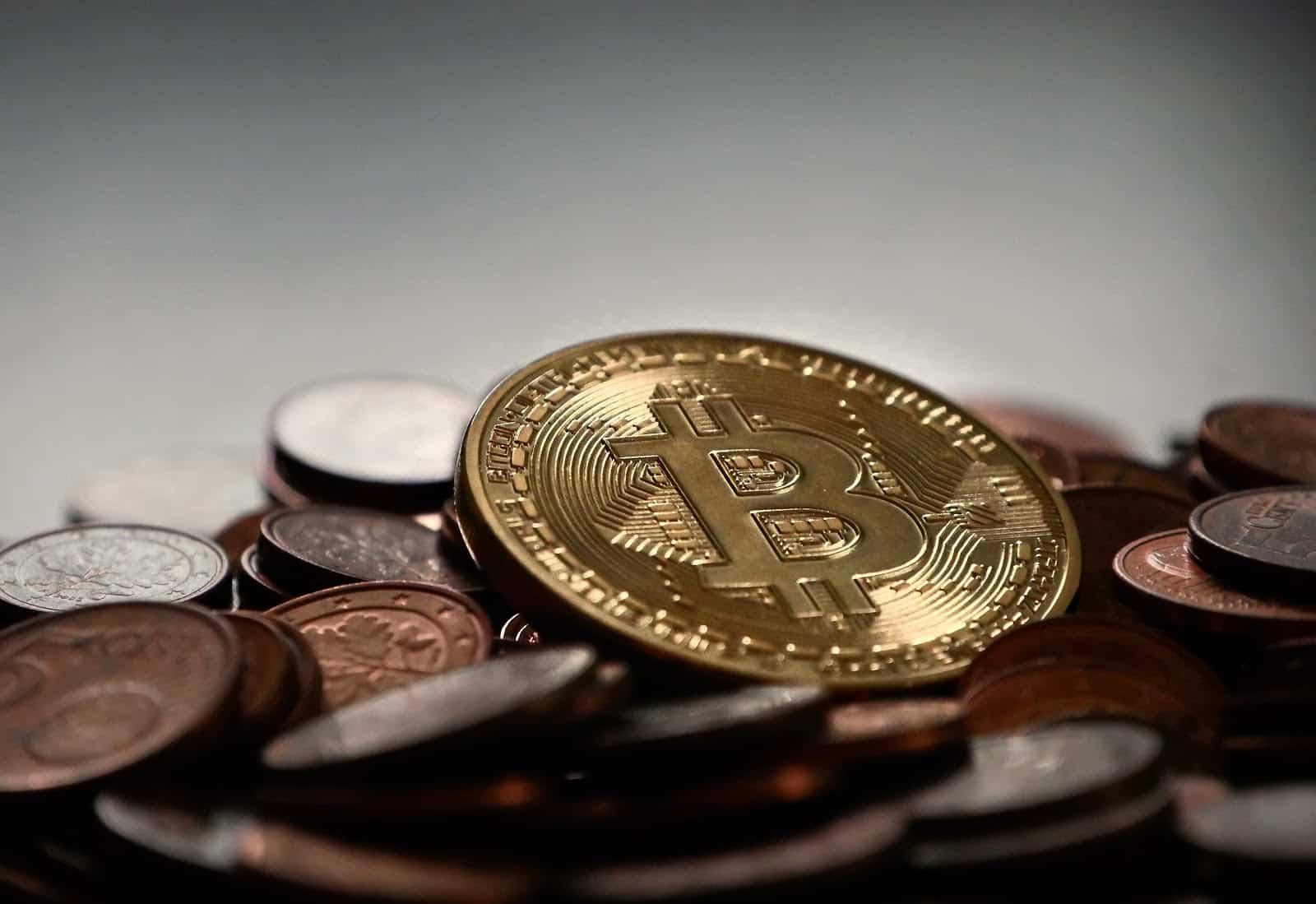 bitcoin representative coin on top of other coins