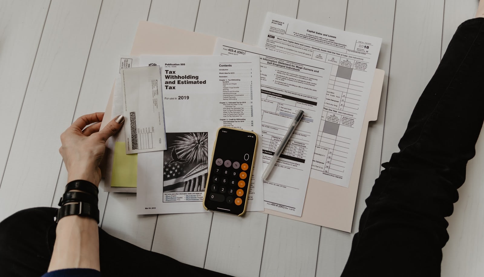 Sole Proprietor vs. LLC: calculator and tax paperwork