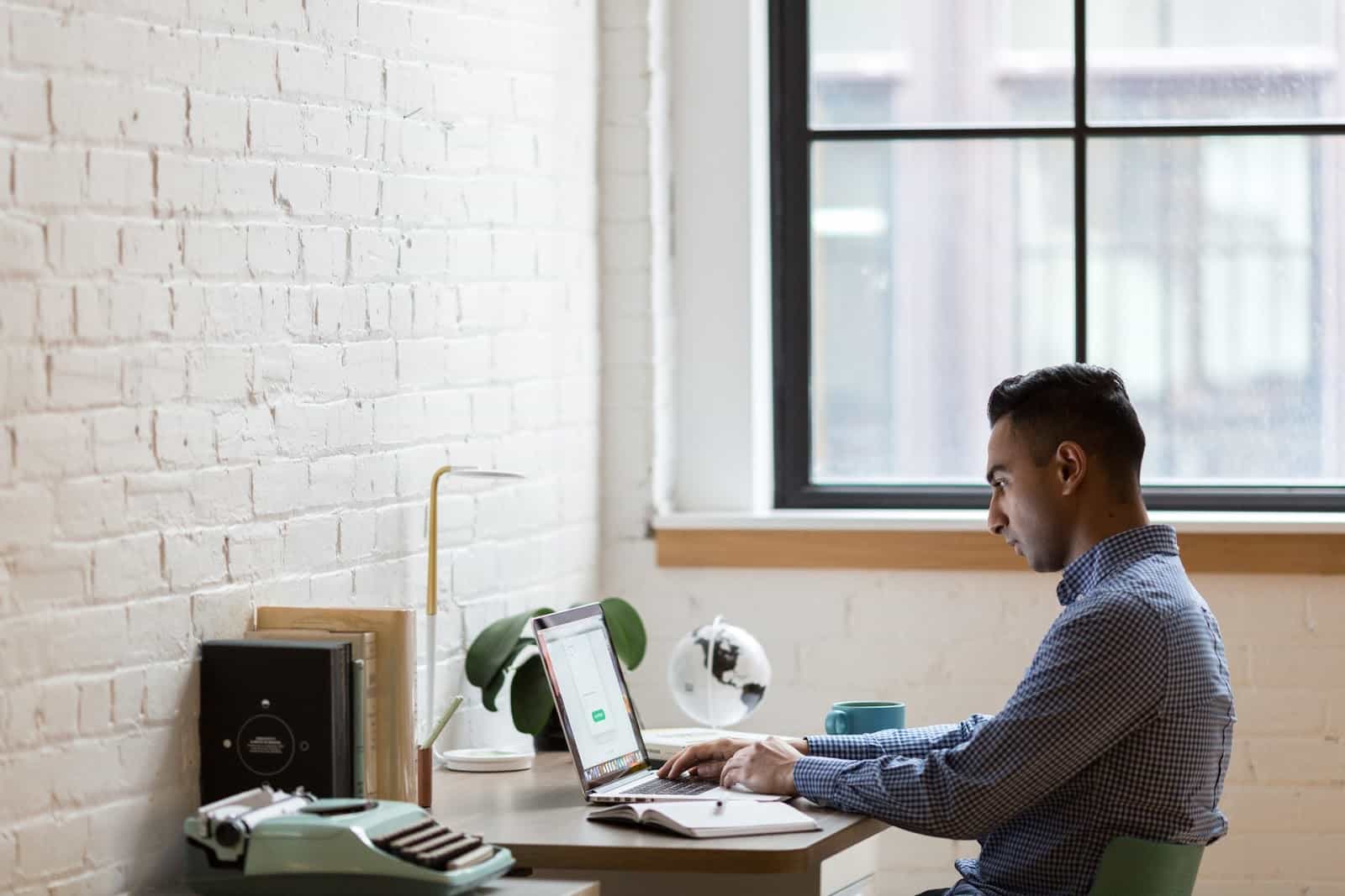 LendingClub: A man sits at a desk in a home office