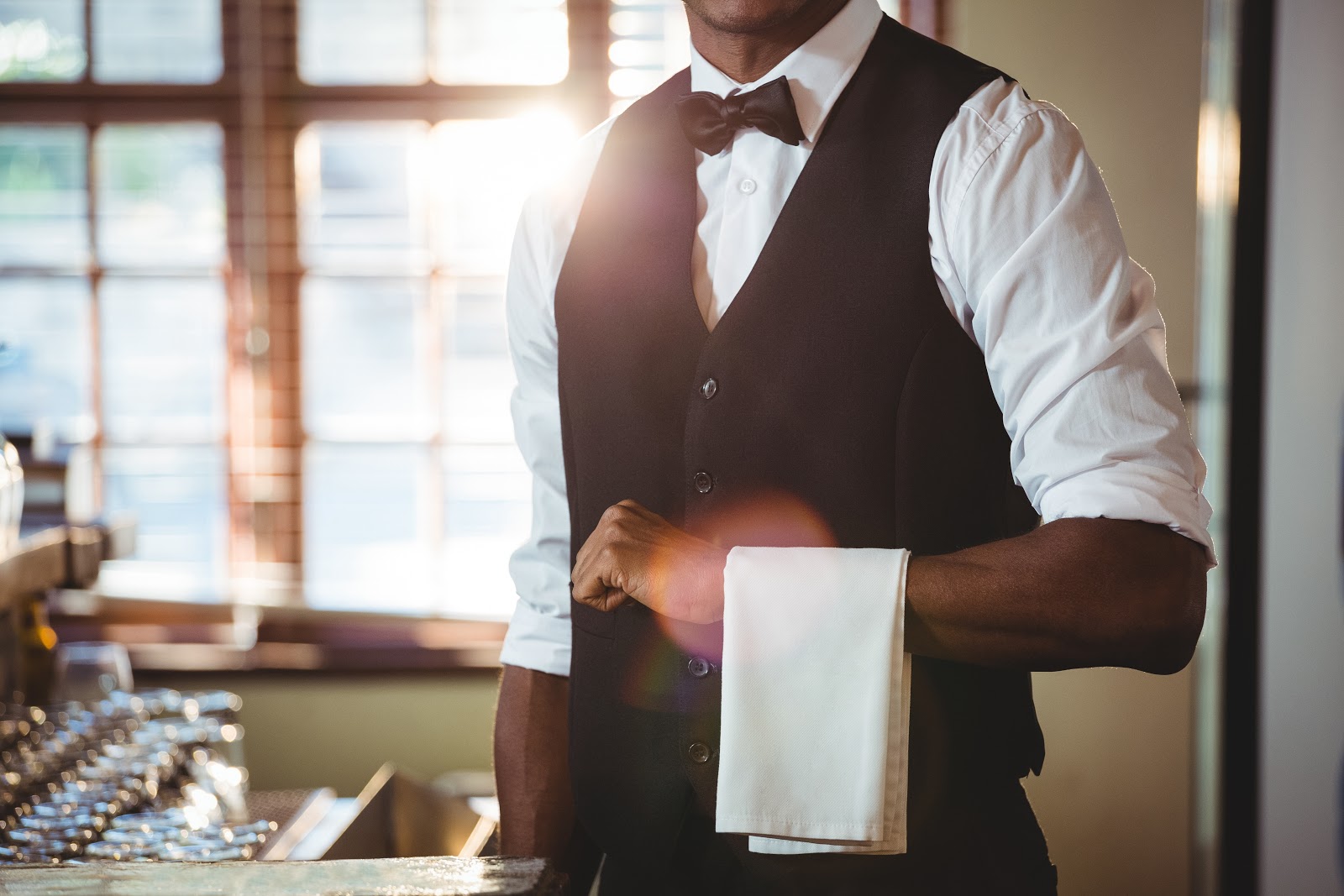 Jitjatjo: server with cloth napkin over arm