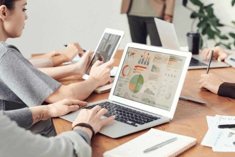 Close-up of a Data Analyst working during a meeting