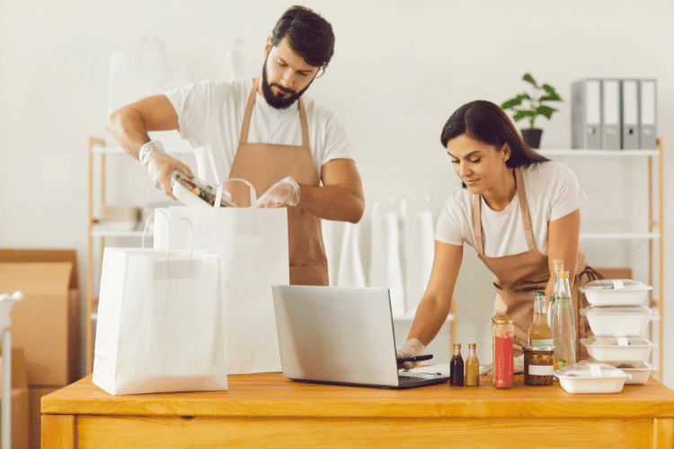 A couple preparing meals ordered from their online food store