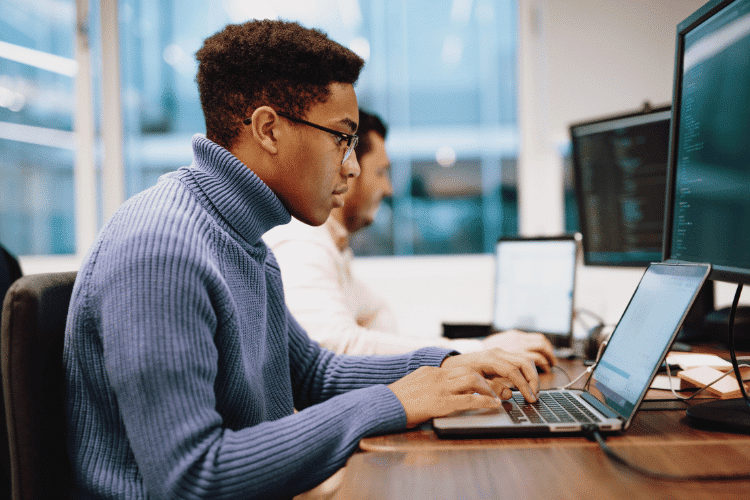 A side view of Software engineer wearing eyeglasses during her work