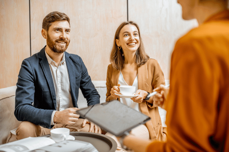 Young Couple with Property Manager in the Office